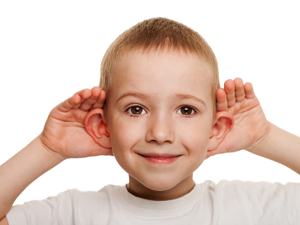 Smiling human child hand listening deaf ear gossip